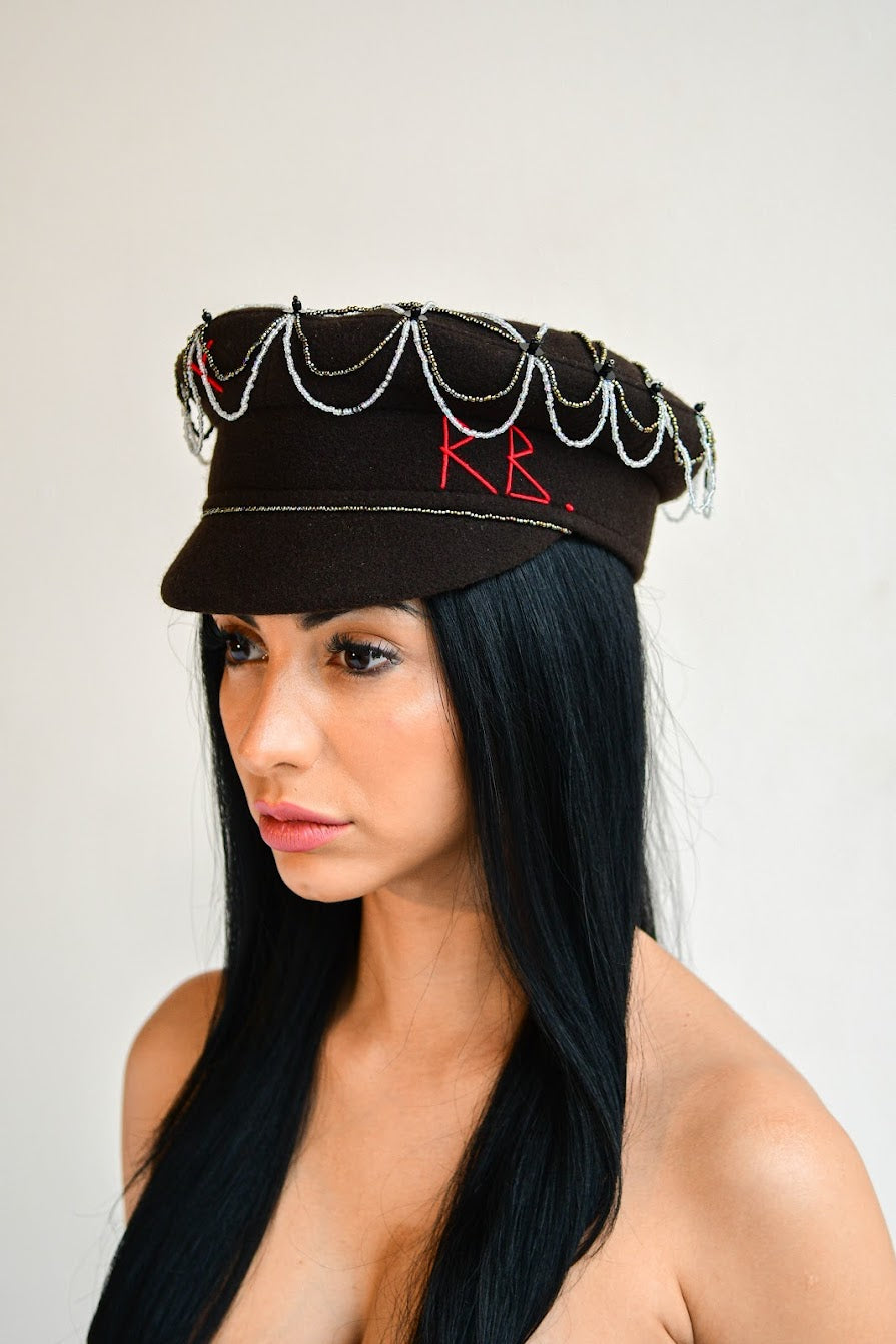 Black Ruslan Baginskiy hat featured in Emily in Paris, adding Parisian charm.